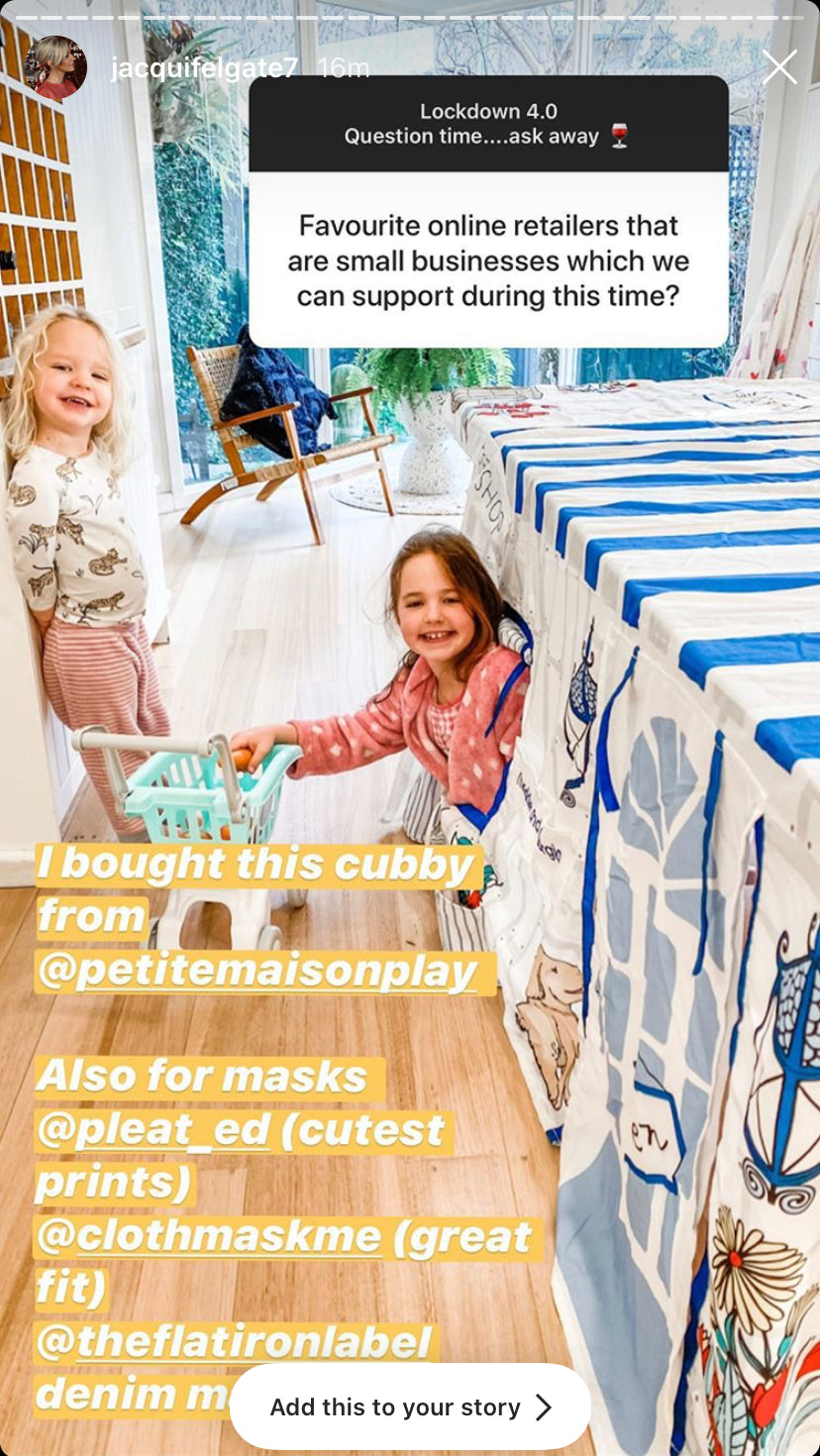 Image of small child peeking out from Petite Maison Play Petite Shop cubby with the words I bought this cubby from Petite Maison Play