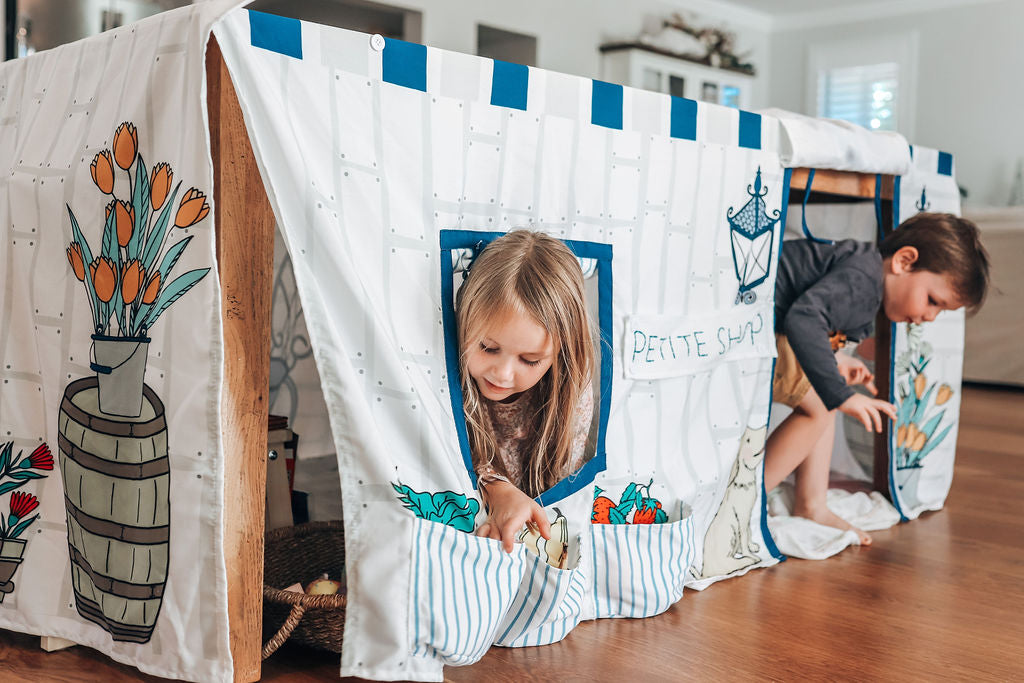 Image of 2 children playing inside Petite Maison Play Petite Shop Table Tent cubby
